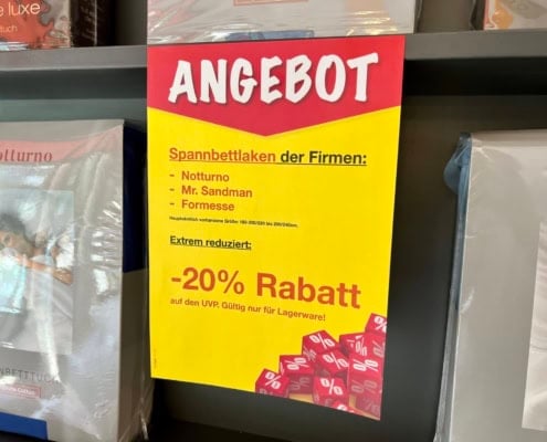 Angebotsplakat für Spannbettlaken bei Bettenhaus Schlafoase Nürnberg mit 20% Rabatt.